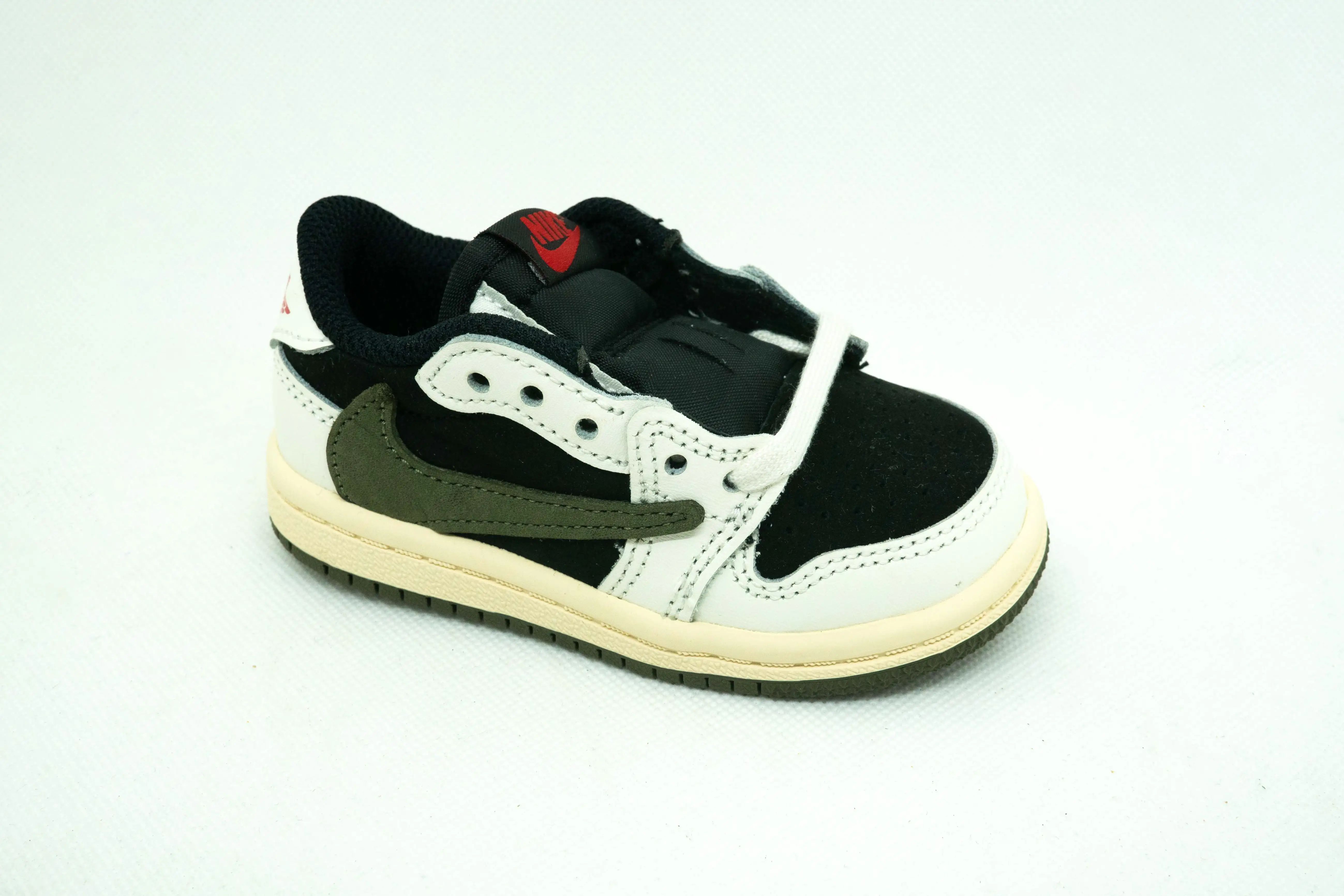 Jordan 1 Low TRAVIS SCOTT OLIVA (NIÑOS)