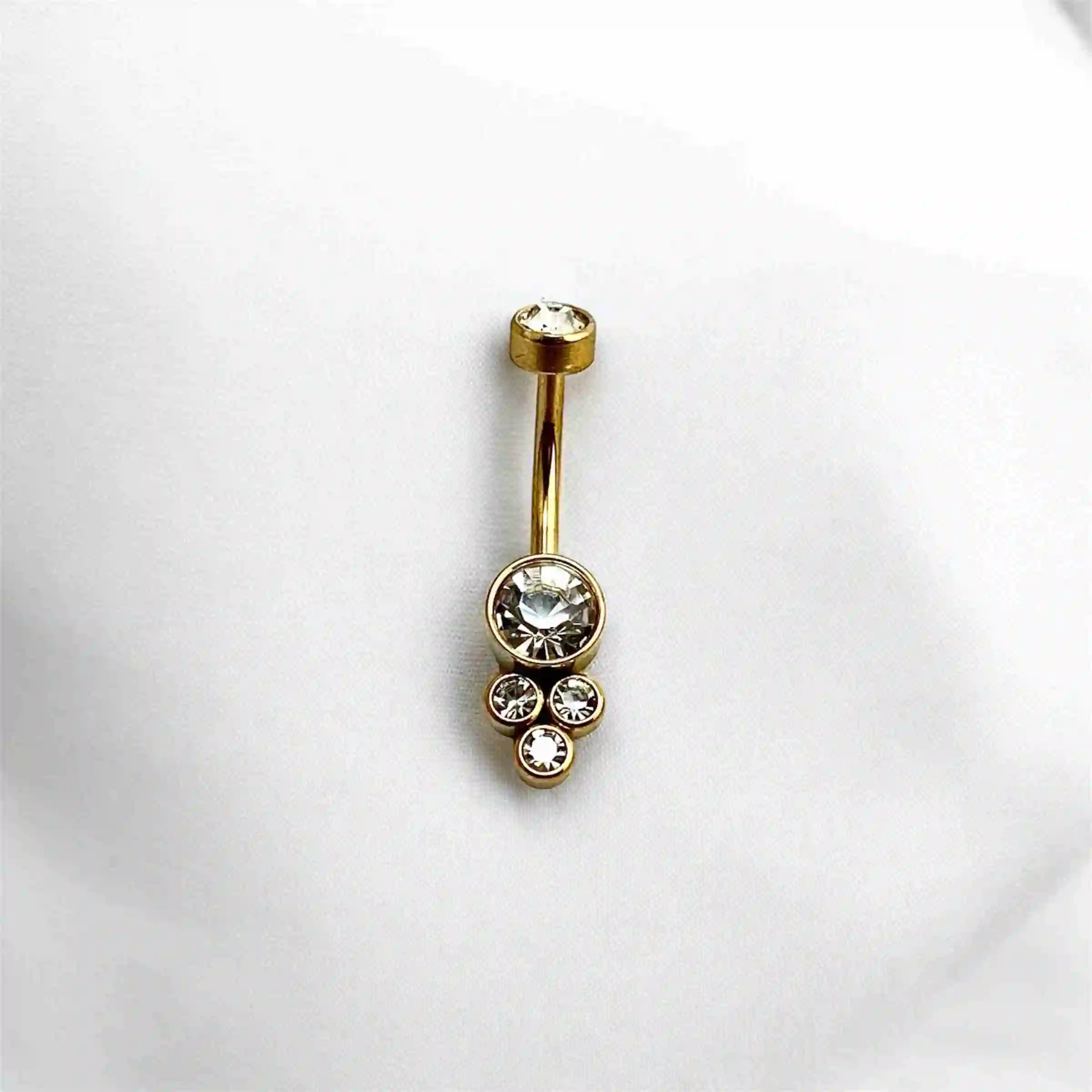 Piercing dorado ombligo tres bolas ornamentales con brillo