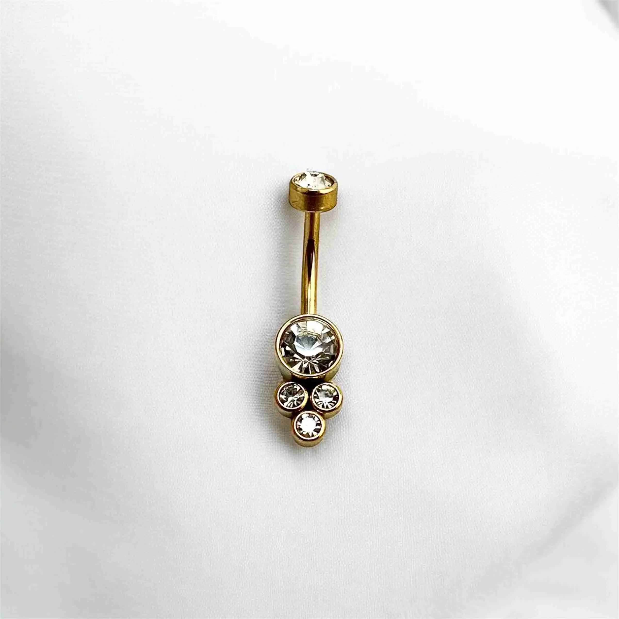Piercing dorado ombligo tres bolas ornamentales con brillo