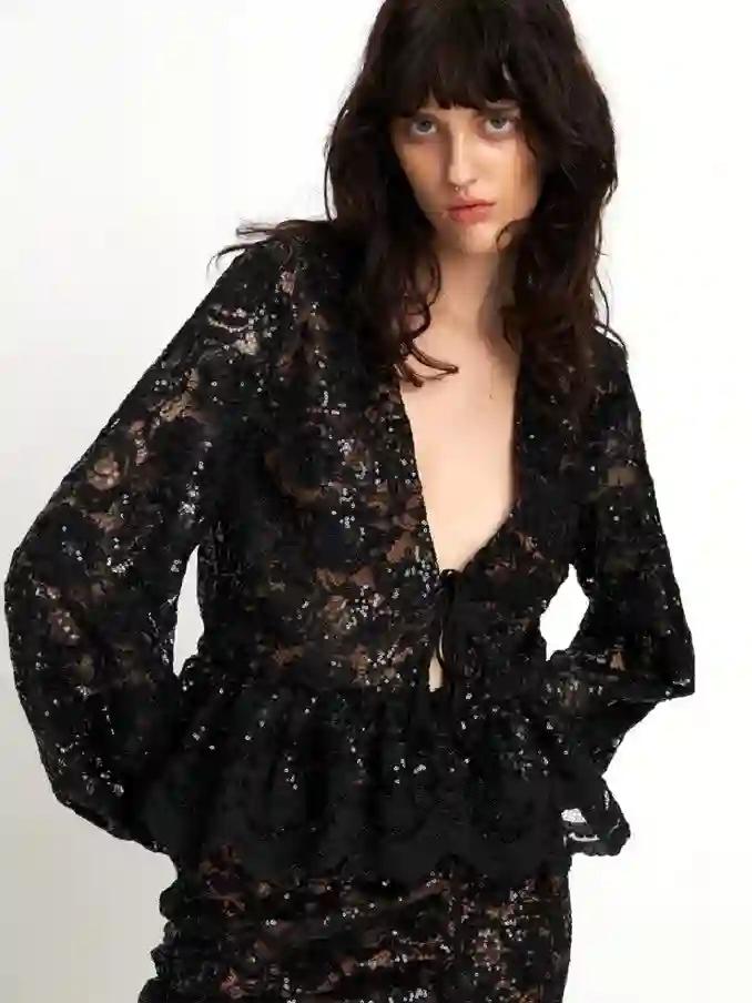 Blusa de lentejuelas de encaje negro de stella nova