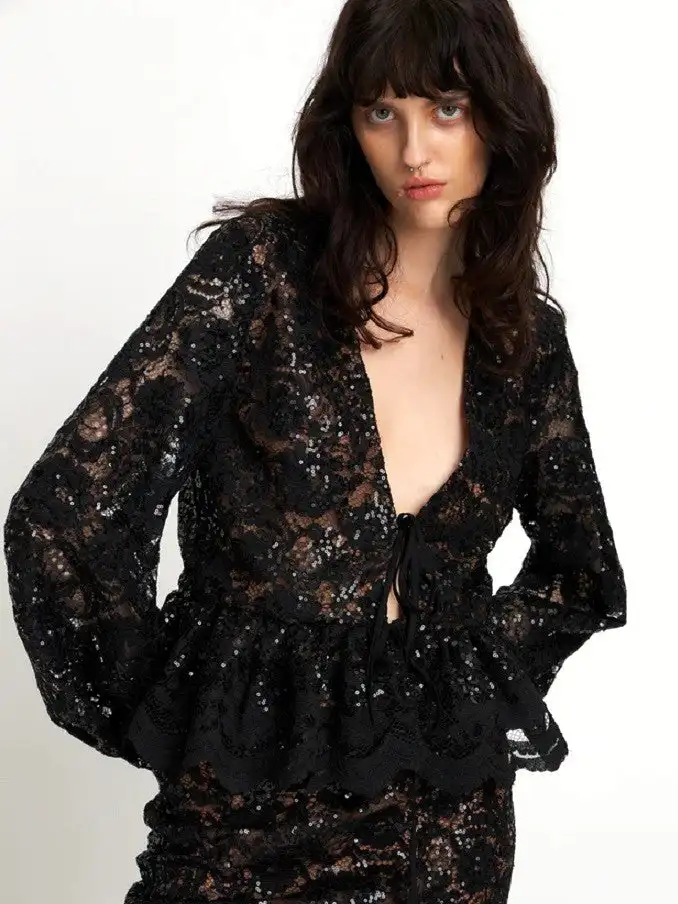 Blusa de lentejuelas de encaje negro de stella nova