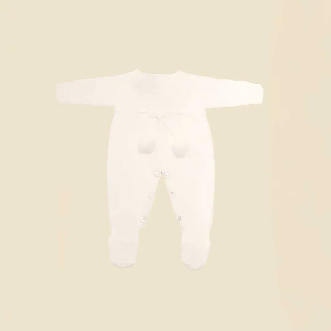 Knitted romper with white pompom