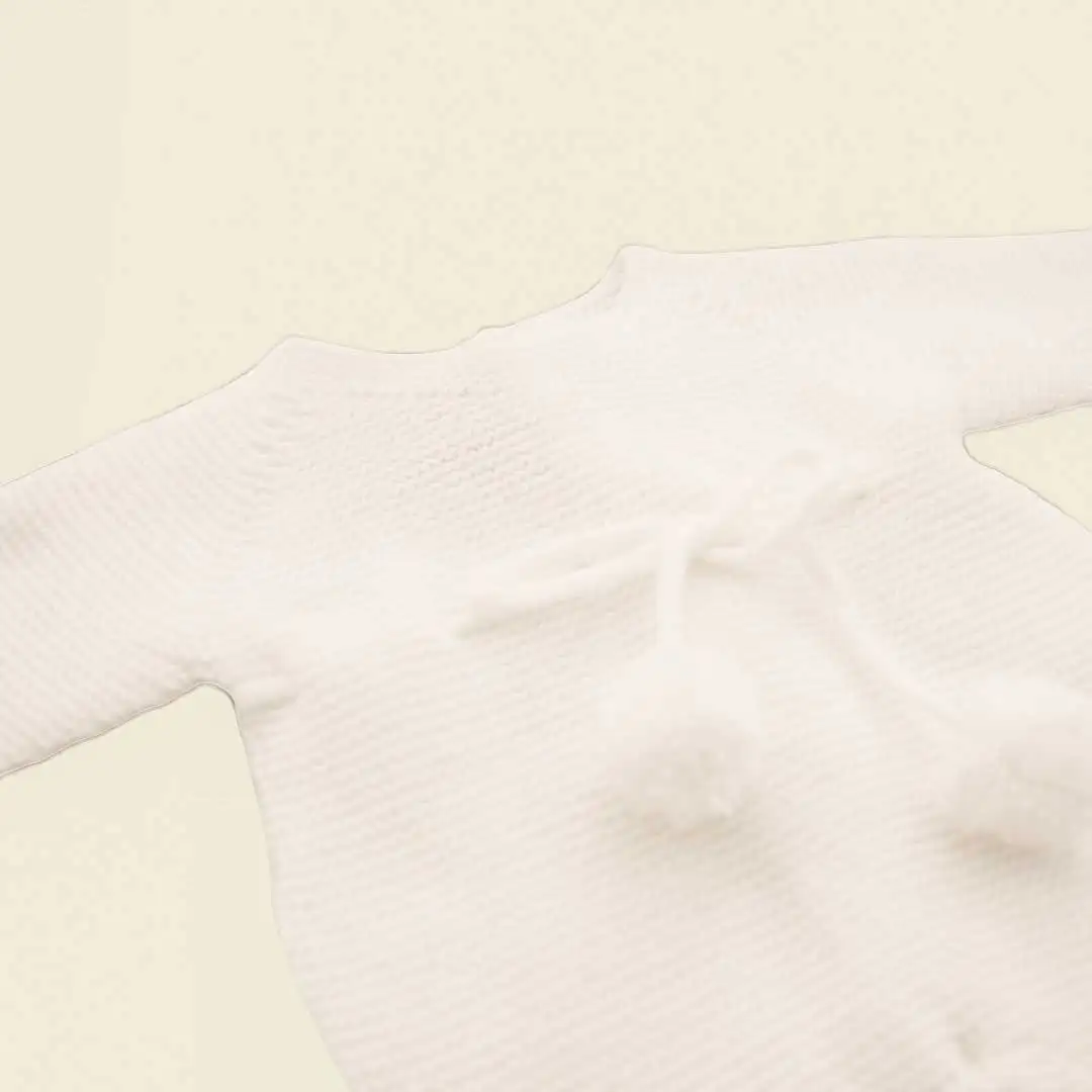 Knitted romper with white pompom - Image 2