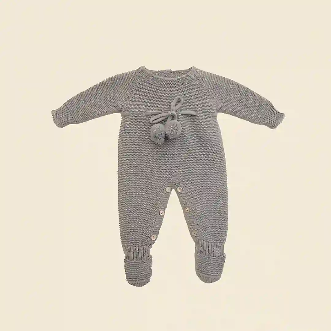 Knitted romper with cloud pompom
