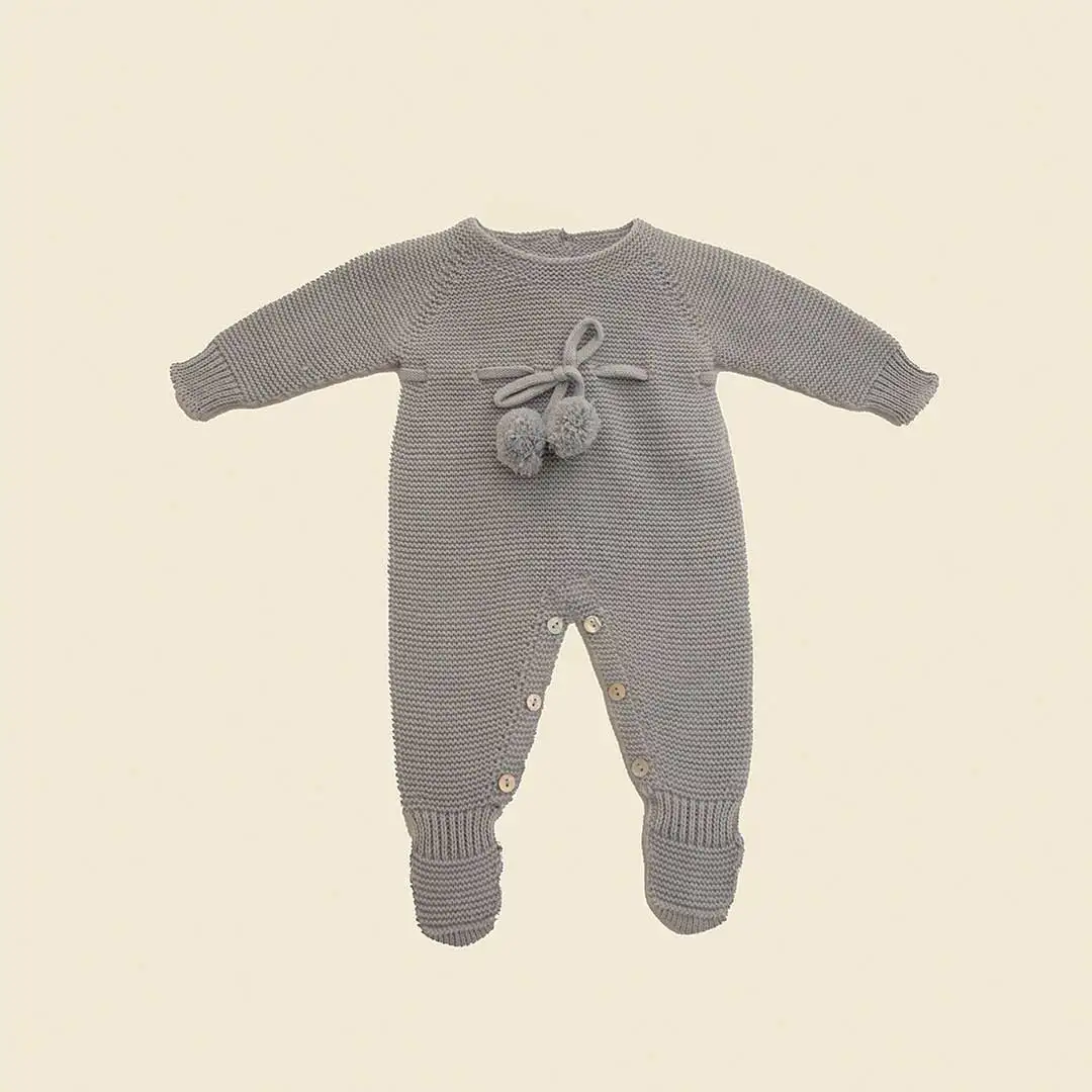 Knitted romper with cloud pompom