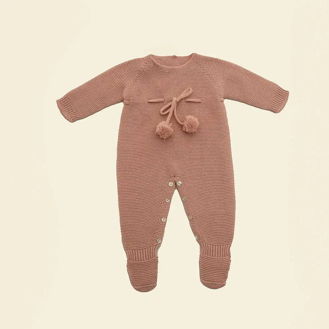 Knitted romper with pink pompom