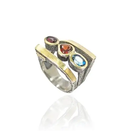 Anillo Styliano Plata y Oro Con Topacios y Granada