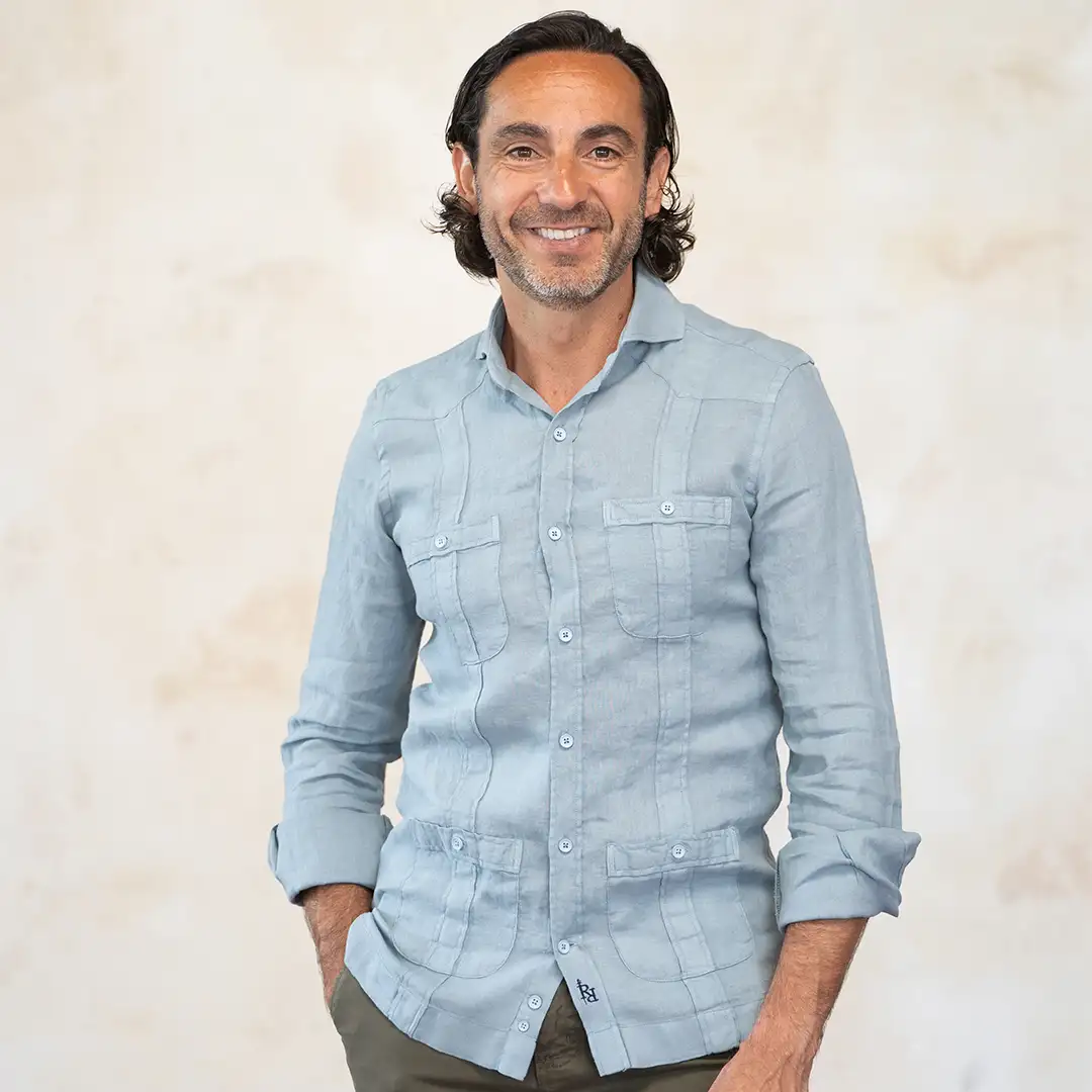 Blue-gray guayabera with contrasting navy blue logo.