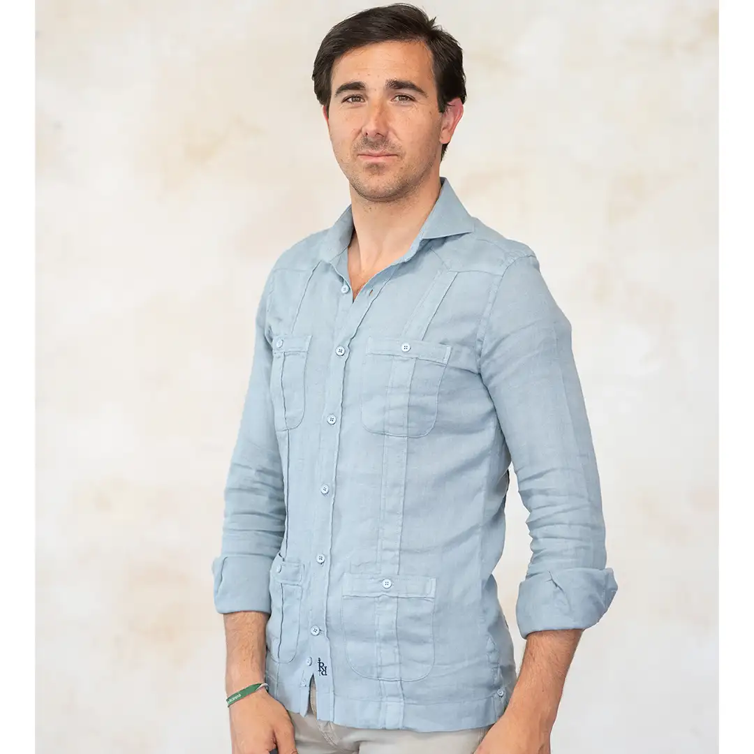 Blue-gray guayabera with contrasting navy blue logo. - Image 2