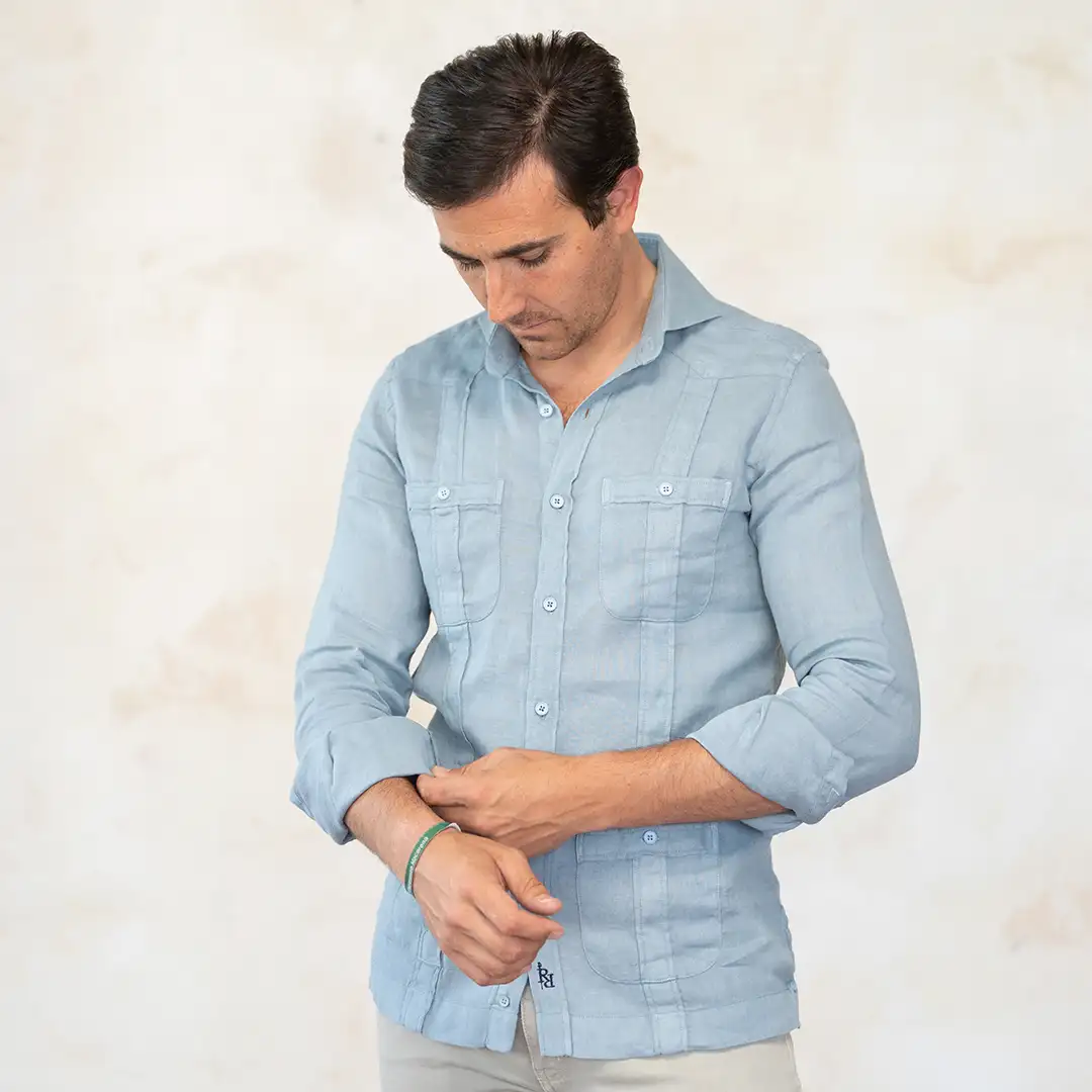 Blue-gray guayabera with contrasting navy blue logo. - Image 3
