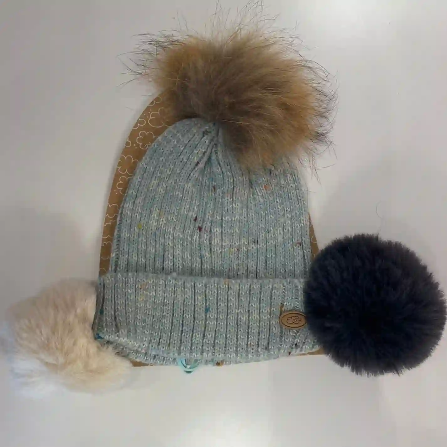 Blue hat with interchangeable pompoms
