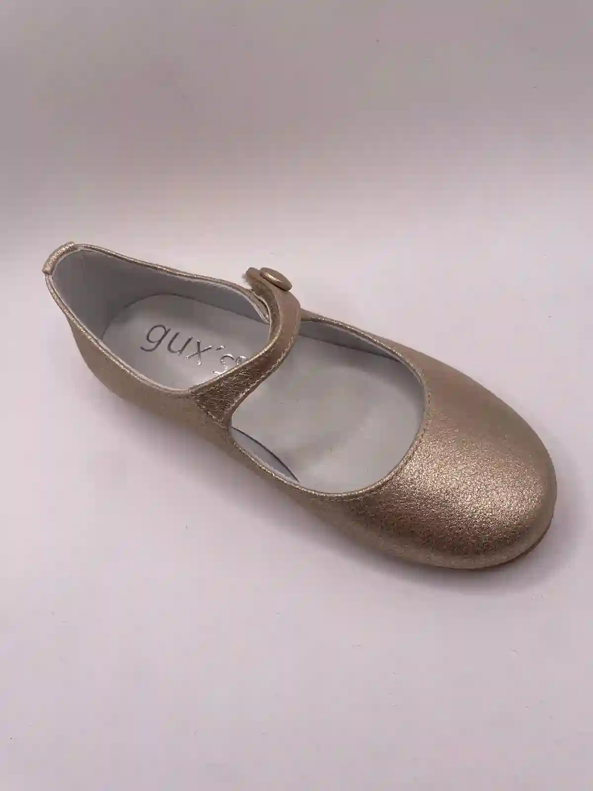 Golden button Mary Janes