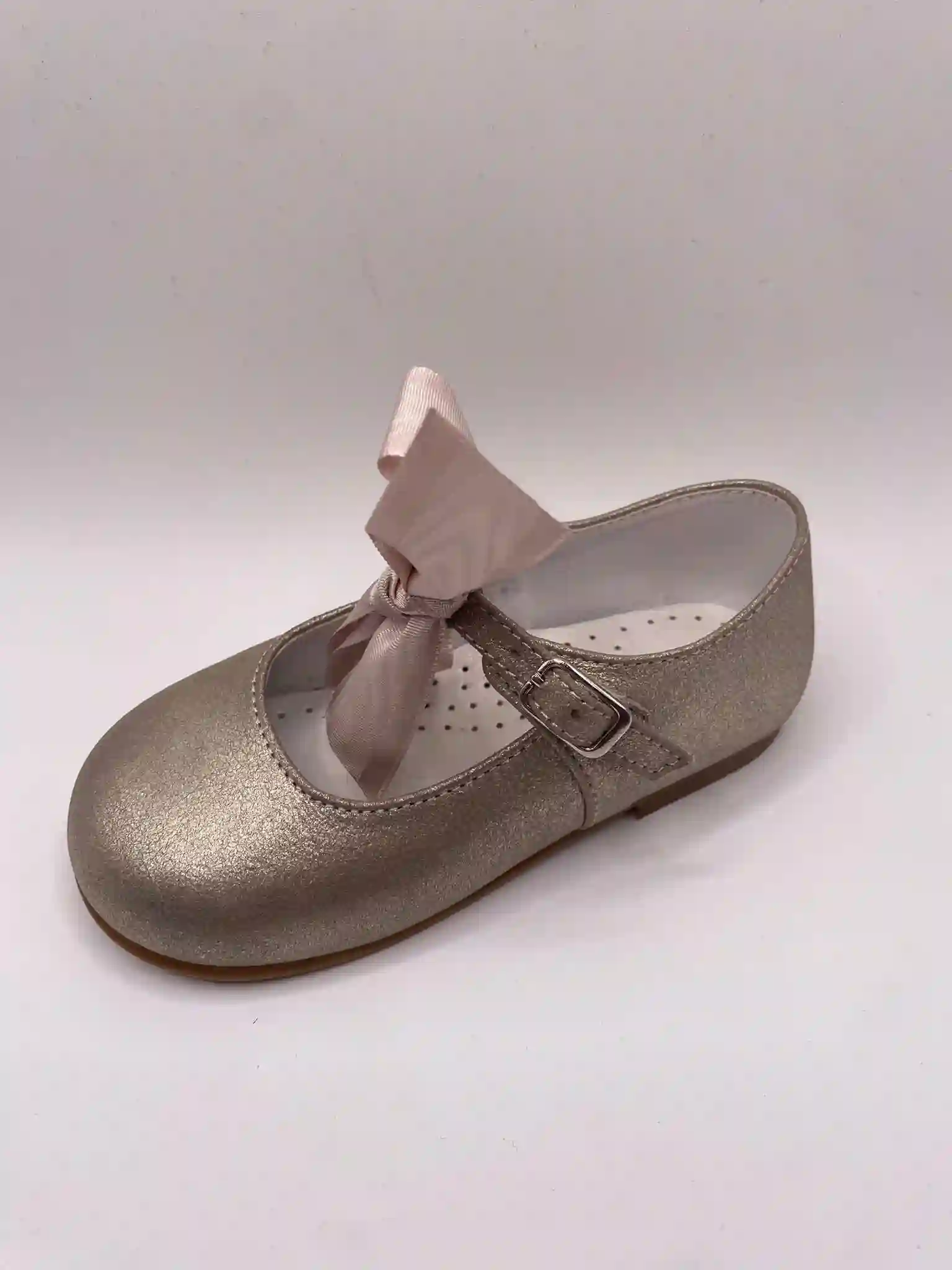 Golden Mary Janes with bow