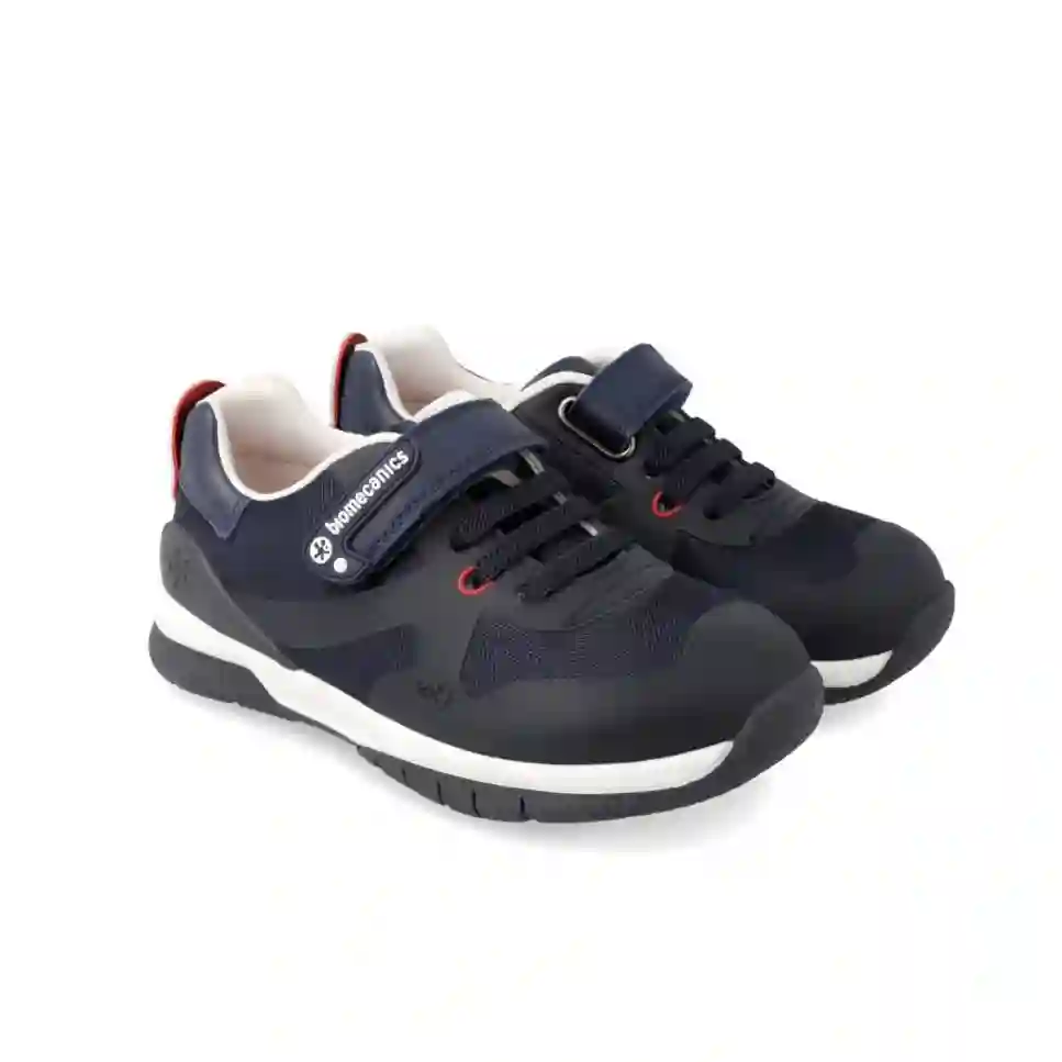 Zapatilla deportiva conrdón elástico y velcro. Tallas 25 a 34.