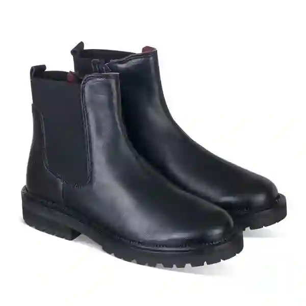 Botín tipo Chelsea en piel negro con cremallera. Tallas 31 a 39.