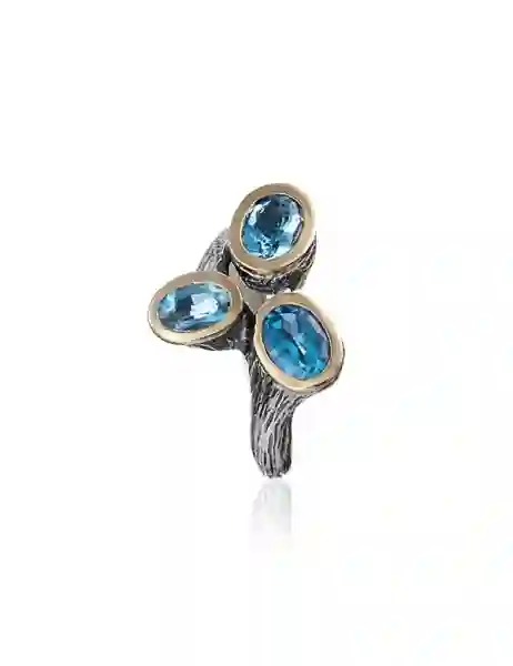 Anillo styliano plata y oro con topacio azul