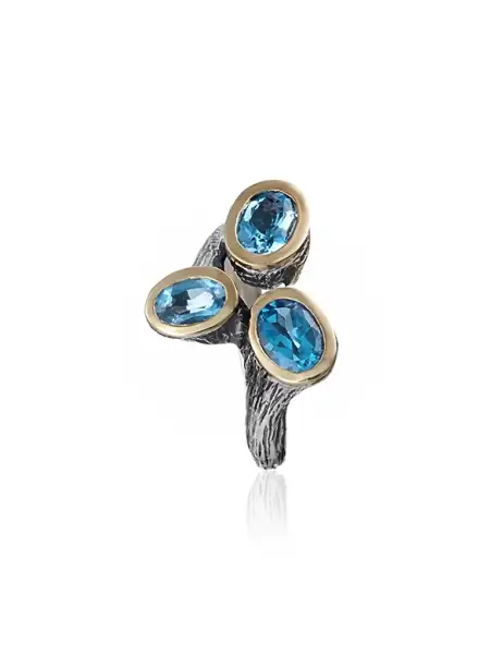 Anillo styliano plata y oro con topacio azul
