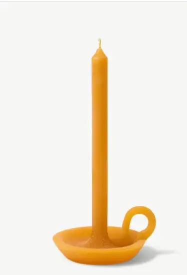 Orange candle with plate