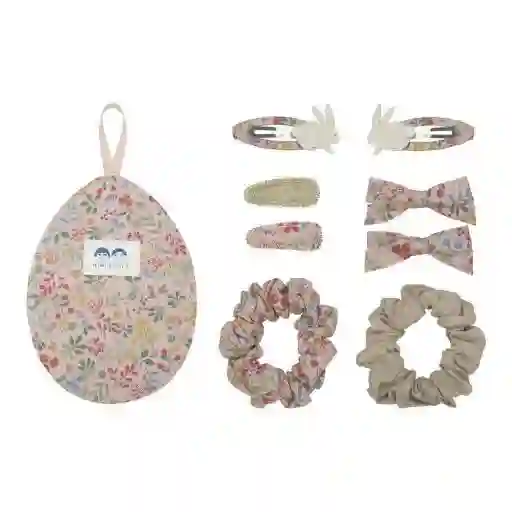 Huevo de pascua rosa con horquillas y coleteros