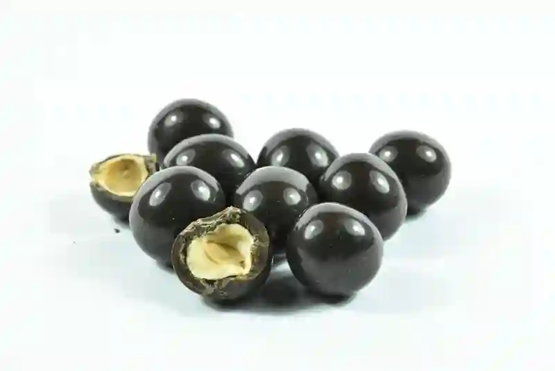 Hazelnuts with black chocolate - 100g