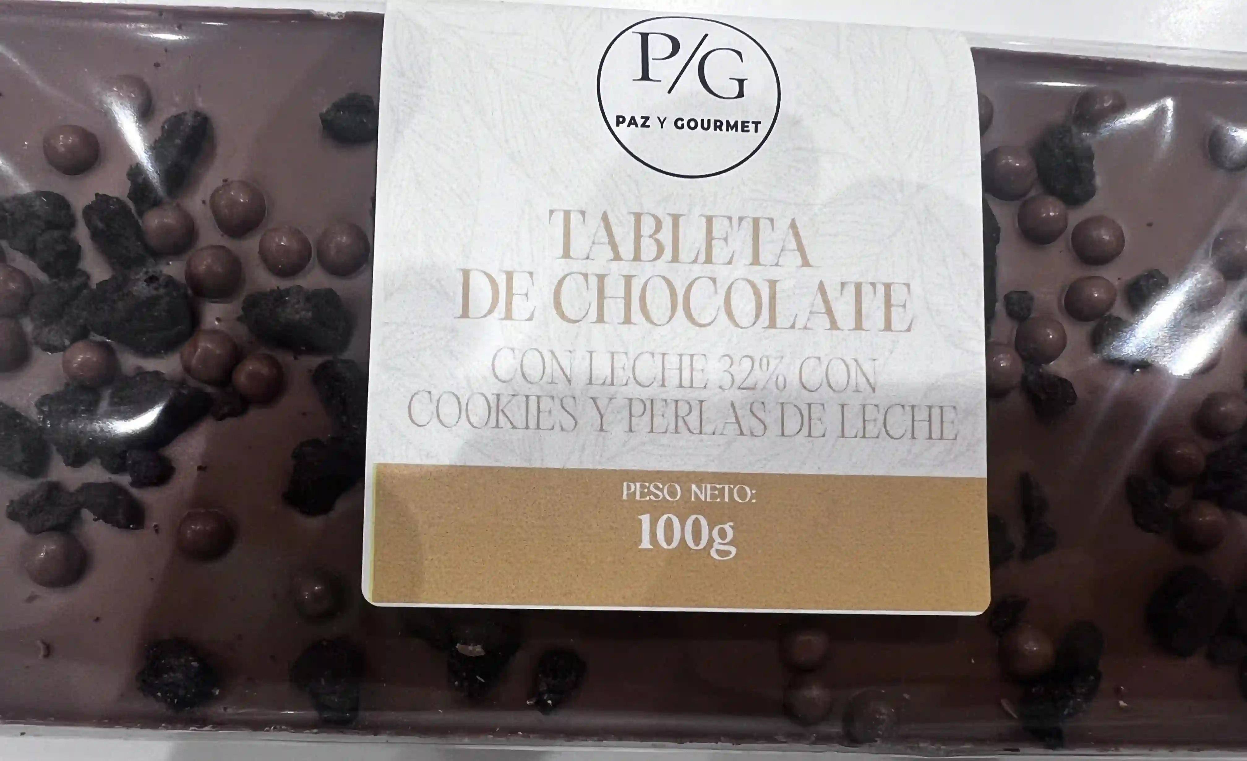 Tableta de chocolate con leche (32%)  cookies y perlas de leche (100 gr)