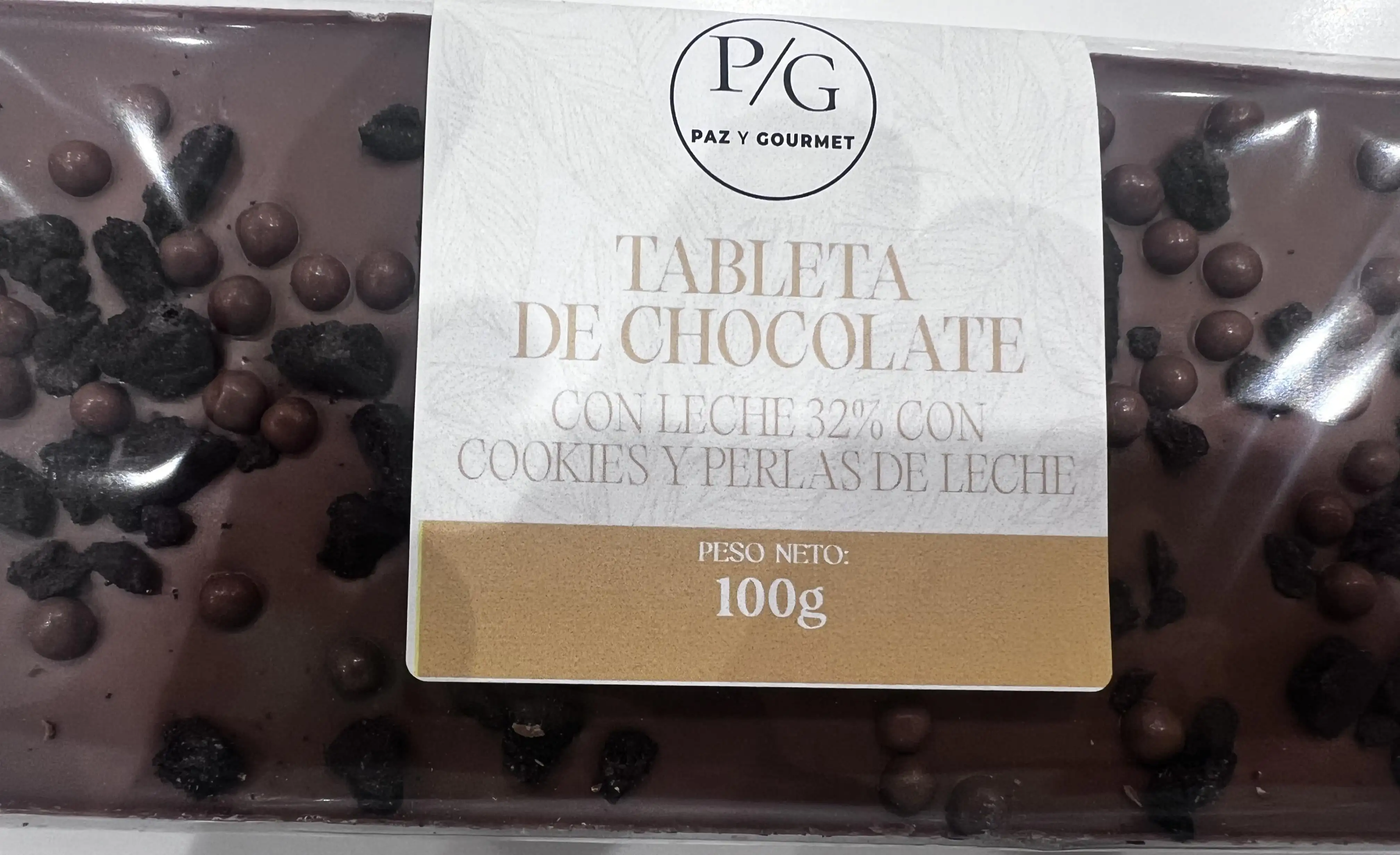 Tableta de chocolate con leche (32%)  cookies y perlas de leche (100 gr)