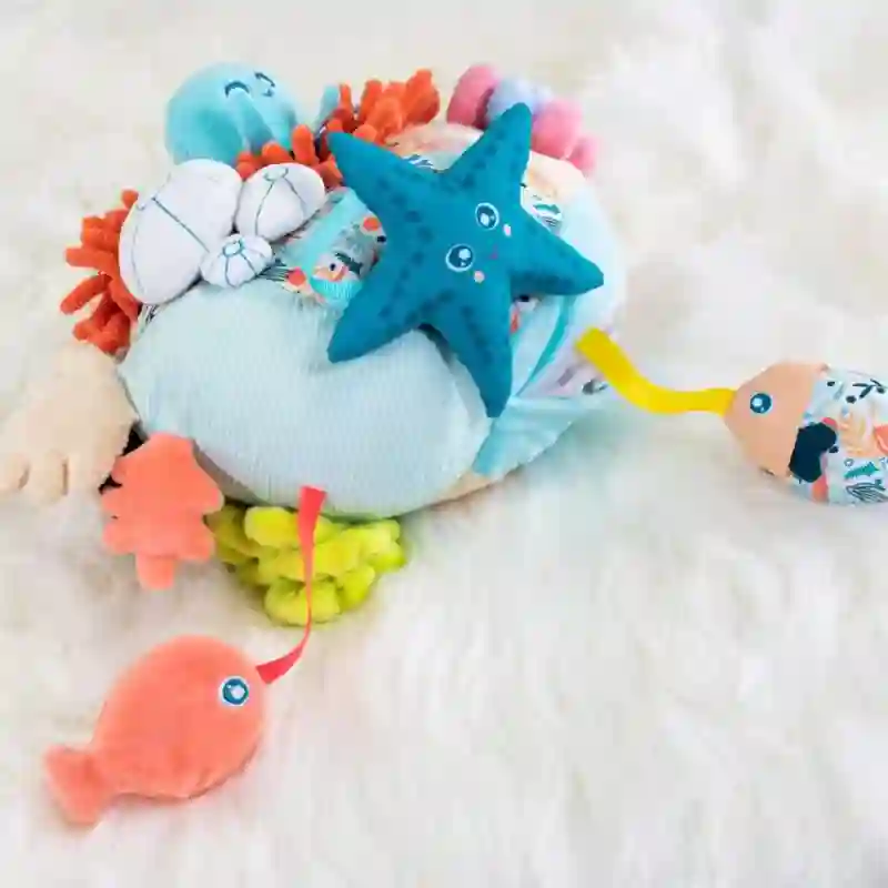 Peluche sensorial, coral - Miniland