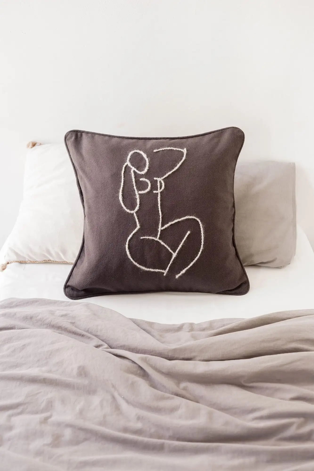 Magnolia cushion (dark gray and blue embroidery) / Studio.fi