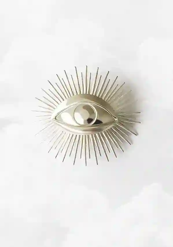 BROCHE OJO RAYOS PLATA