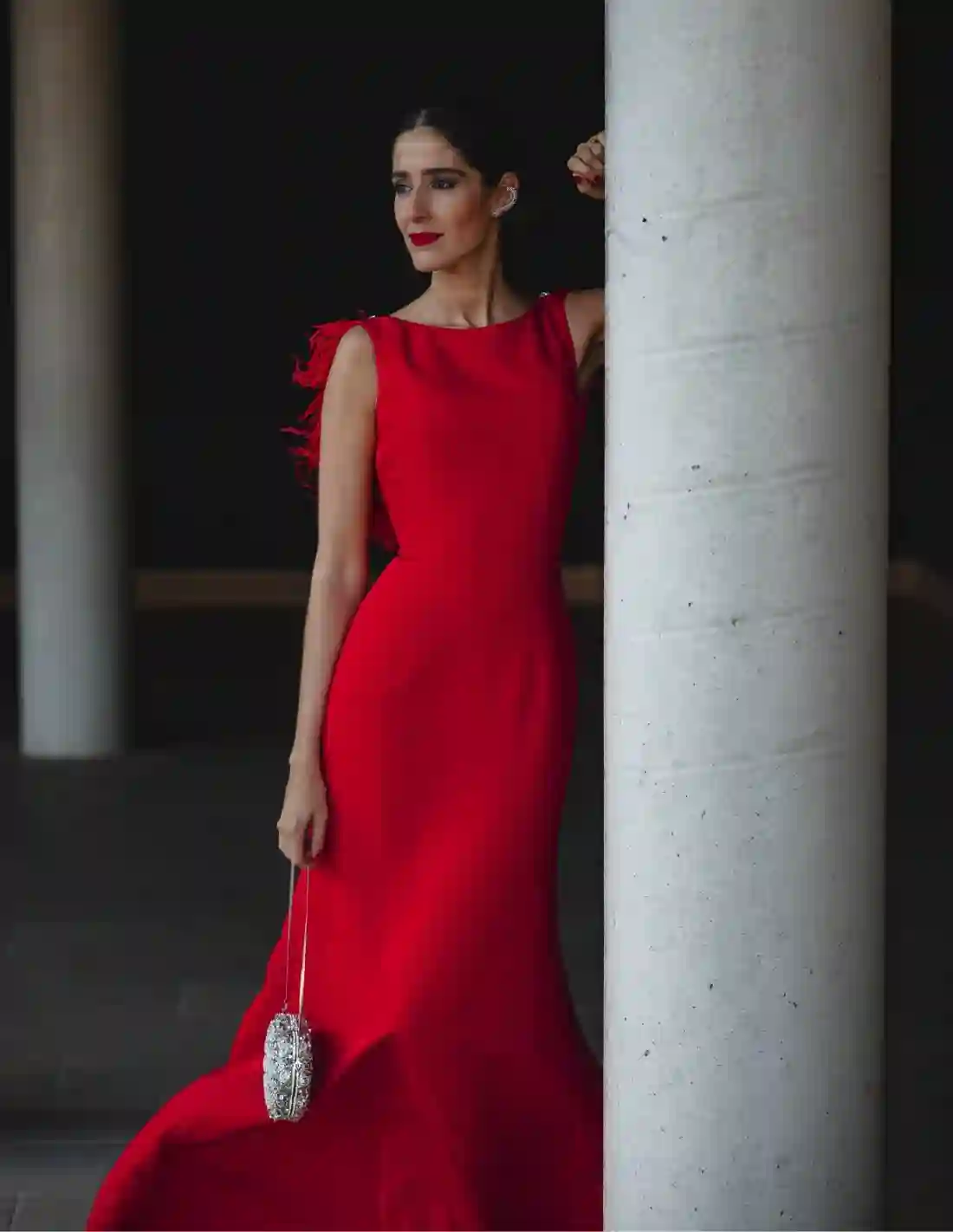 Long party dress with a feather back neckline